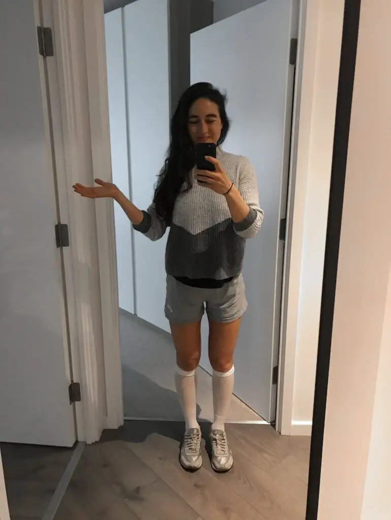 mirror selfie of Zoe tehrani just after coming off crutches, a step forwards in post op rehab.