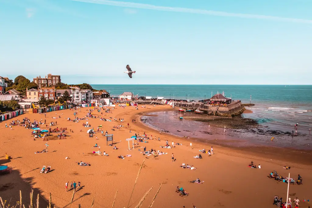 Broadstairs beach with lots of people on a sunny day.