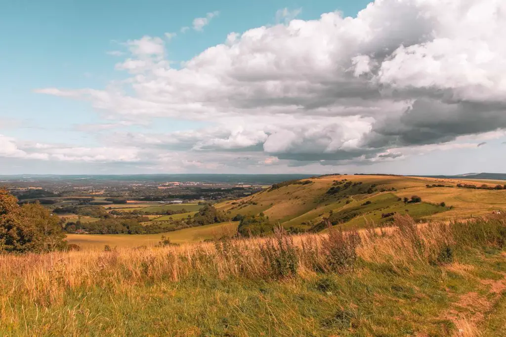 A walk along Ditchling Beacon, on the way to Lewes with field down to the villages below.