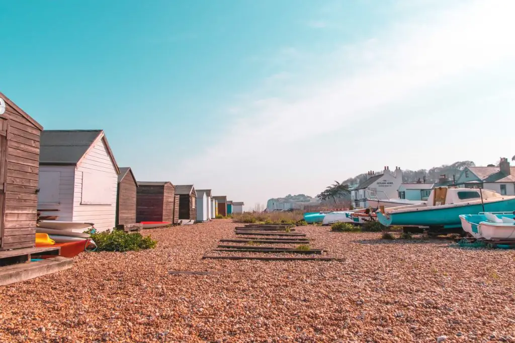 Beach huts on a shingle beach in Kingsdown on the walk from Dover to Deal.