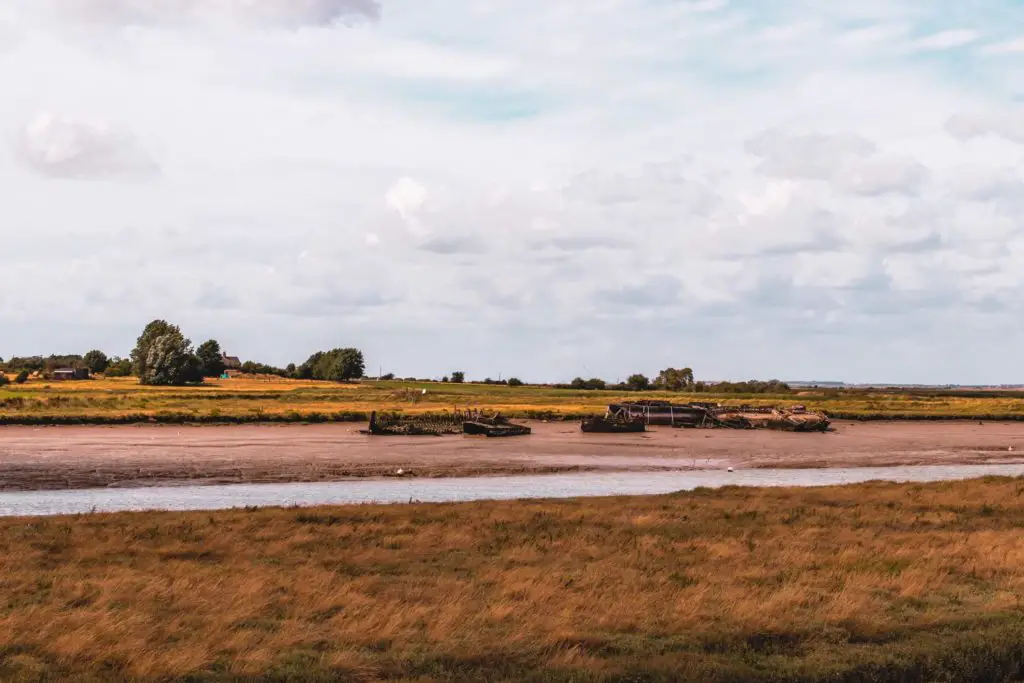 Boat wrecks laying on the muddy river back on the route from Faversham to Whitstable.