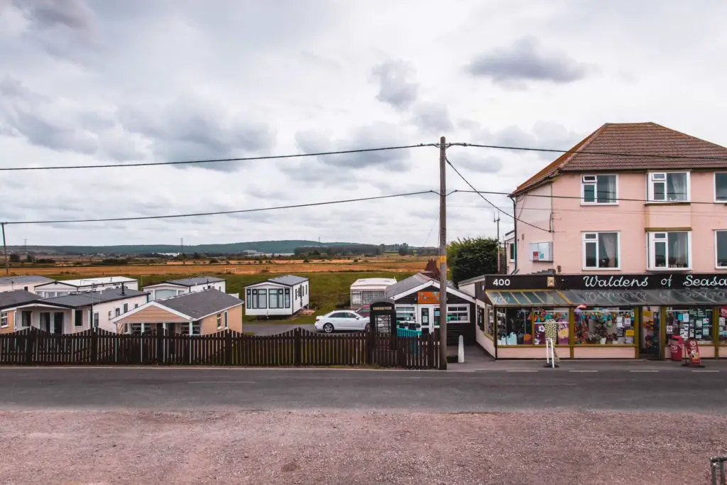 Seasalter village shop next to mobile homes and a black telephone box.