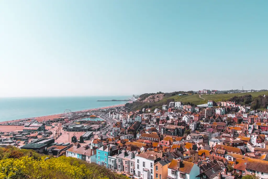 A view overlooking the buildings of Hastings as it meets the ocean.