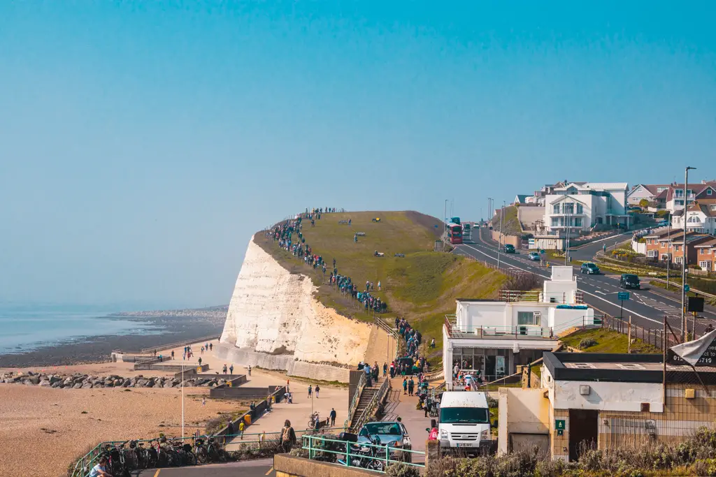 The crowds walking on a cliff on the south east coastal path