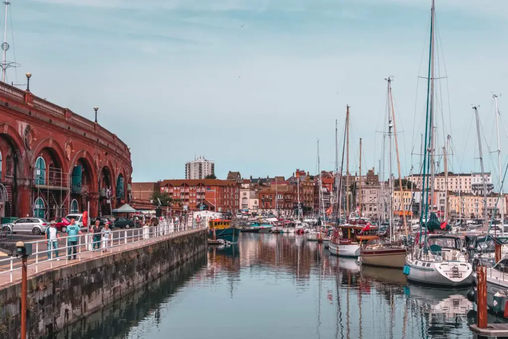 Boats in the royal marina in Ramsgate with buildings in the background