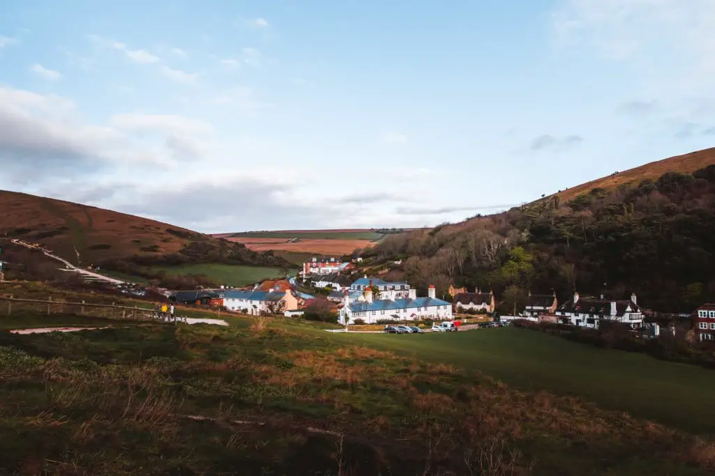 Looking down into the valley of Lulworth and the cluster of houses.