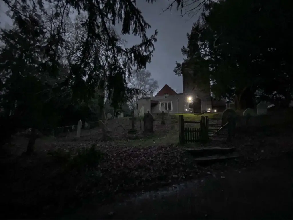 A church and graveyard at night time in the New Forest on the walk back into Brockenhurst from Beaulieu.