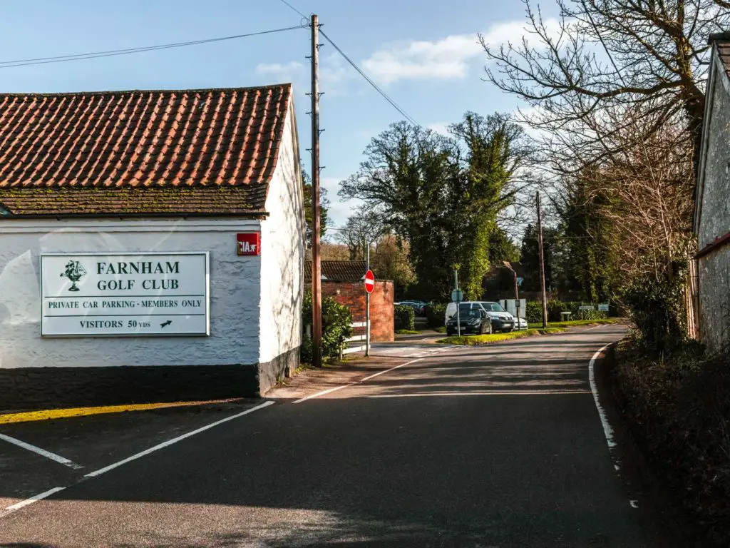 The main road leading past the Farnham gold club building on the left, on the walk from Guildford.