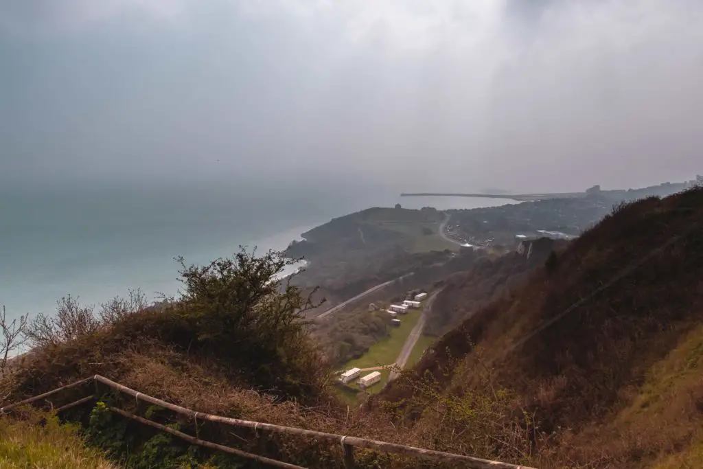 A coastline view over Folkestone on the south east coastal path on a misty day.