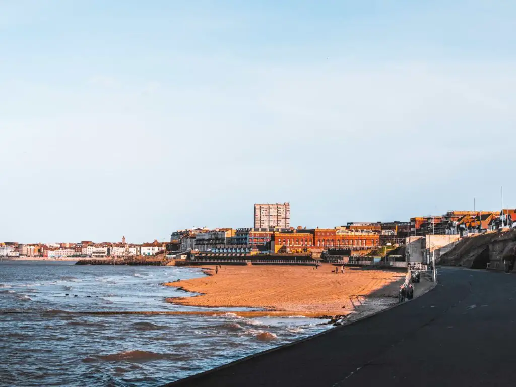 A view of Margate up ahead with the sea on the left.