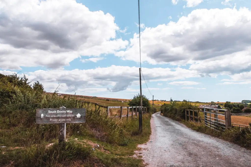 The path with South Downs Way signage on the walk to Devils Dyke.