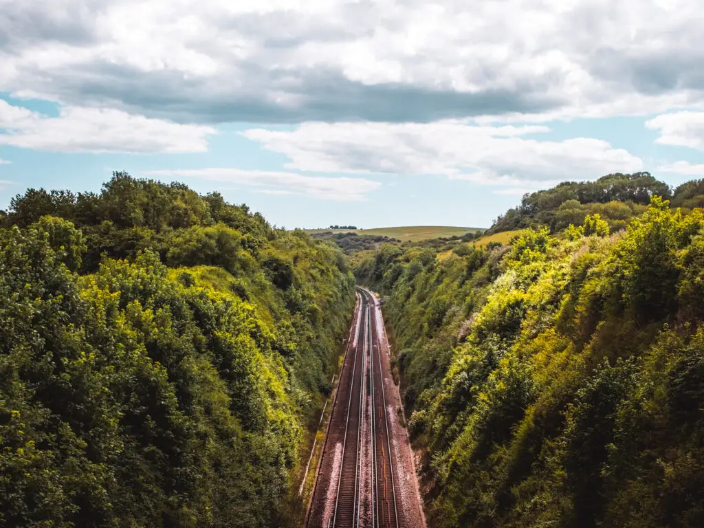 A Birdseye view of train tracks surrounded by trees along the walk to Devils Dyke in the South Downs.