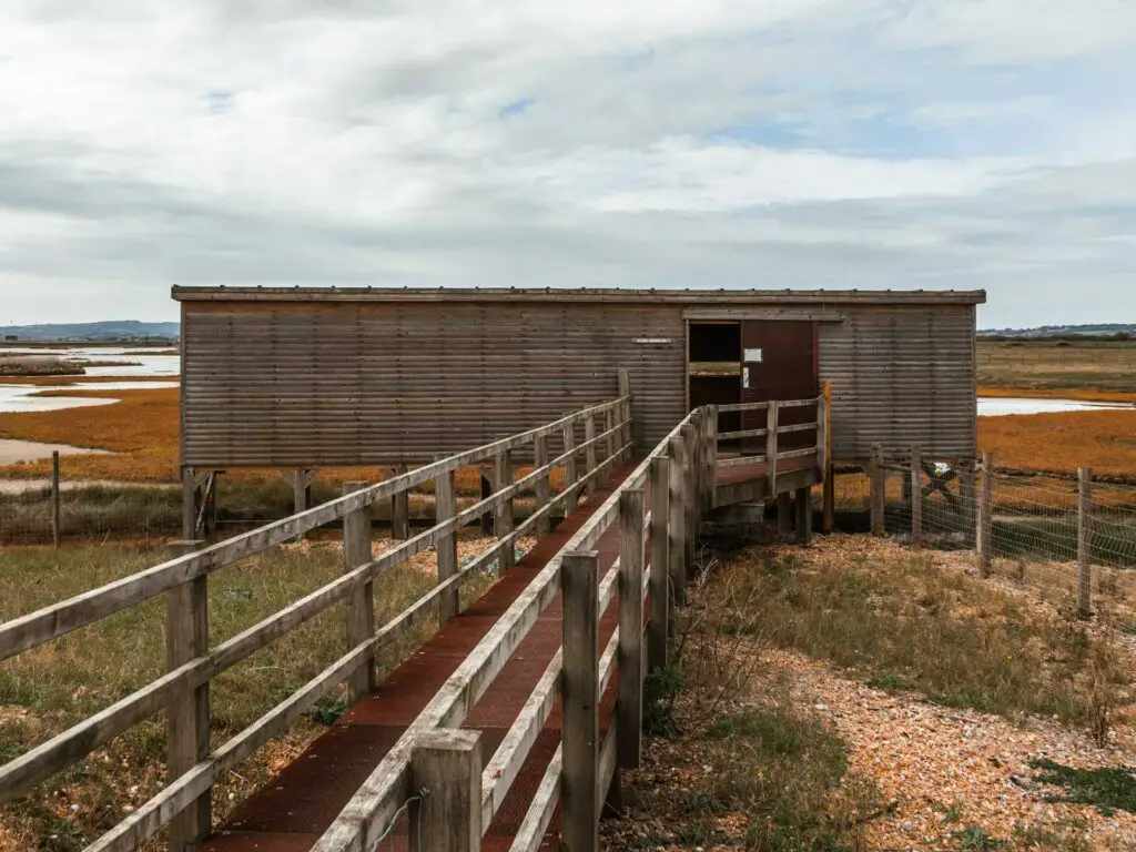A bridge leading to a wooden hut at the Rye Nature reserve.