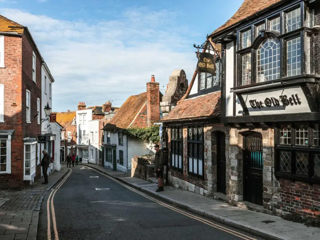 The road leading through the buildings and old pub of Rye.