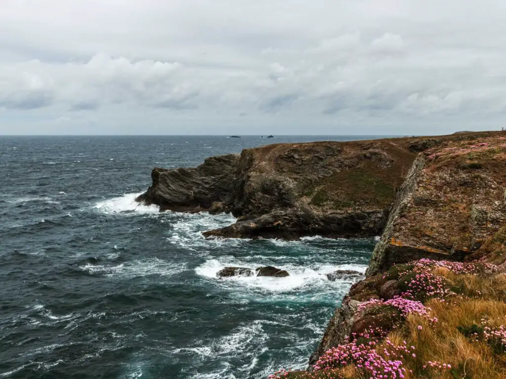 The rough sea as it crashes into the craggy cliffs of the coast of Cornwall.