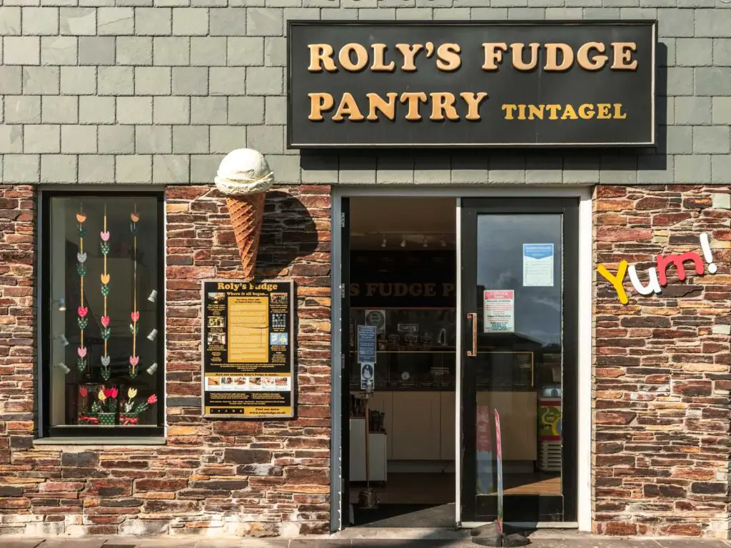 A fudge shop in tintagel. The walls of the shop are made of brick. 