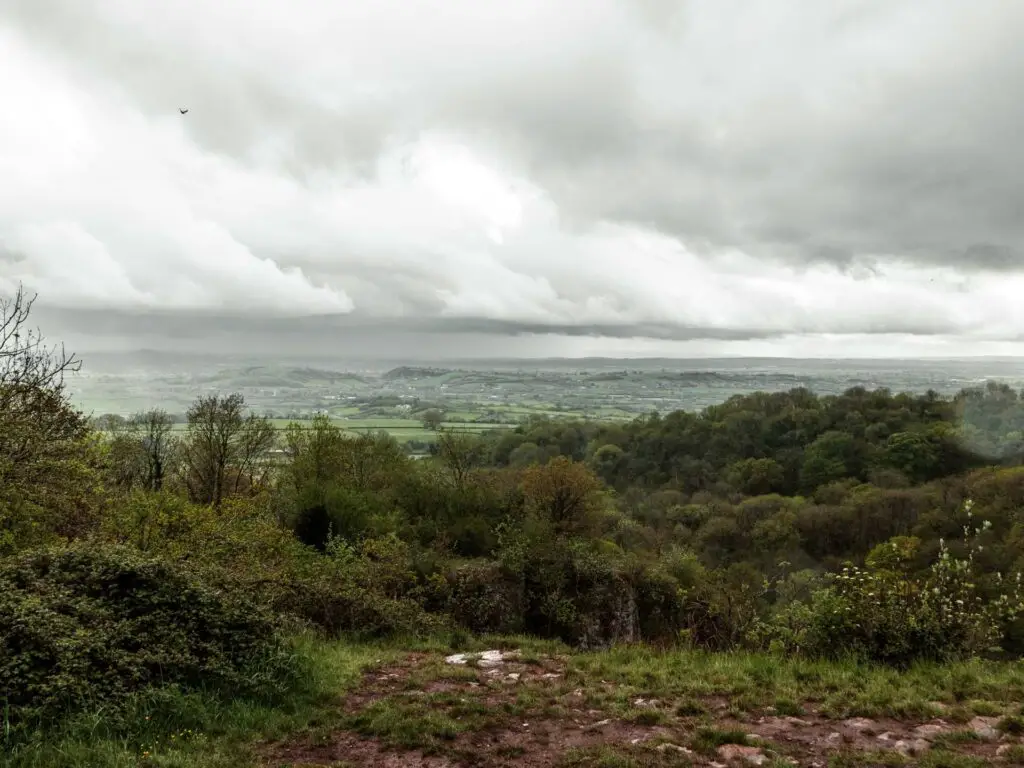 The viewpoint across the Somerset Levels on the Ebbor Gorge walk. it is an overcast day.