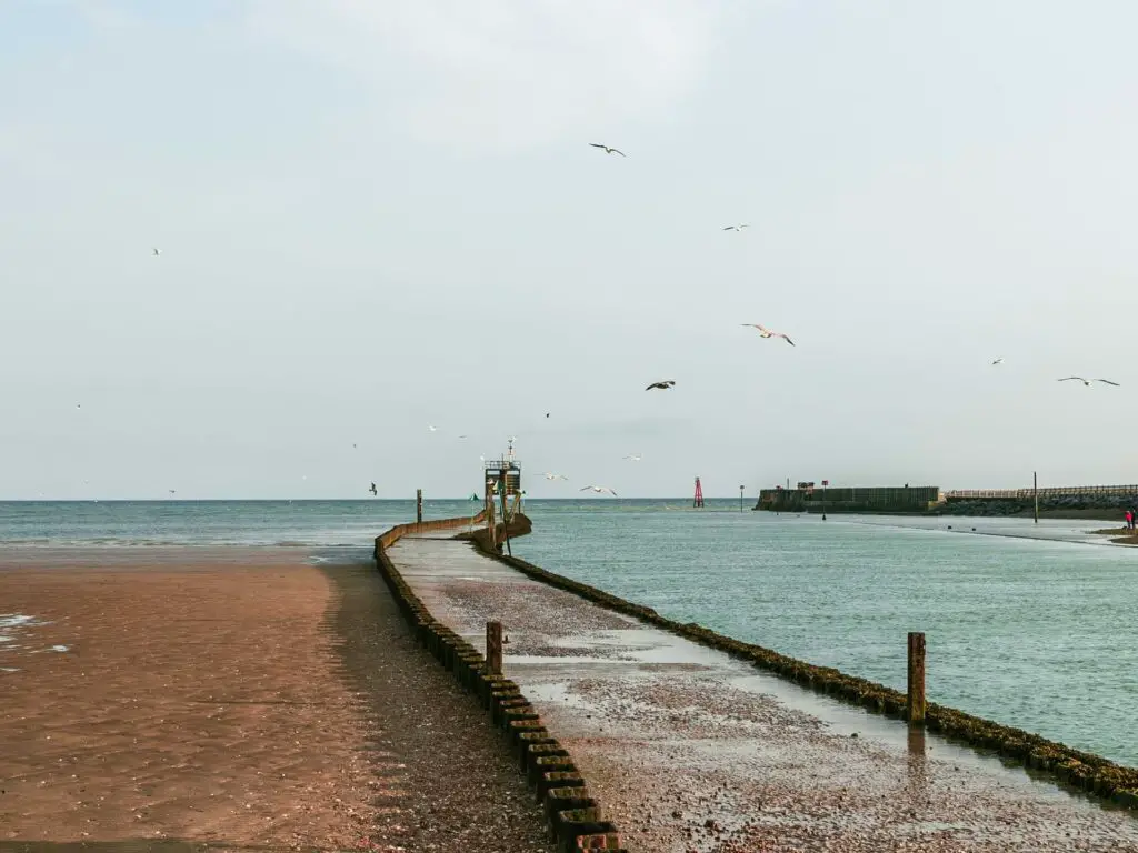 A pire leading out to the sea from Camber Sands