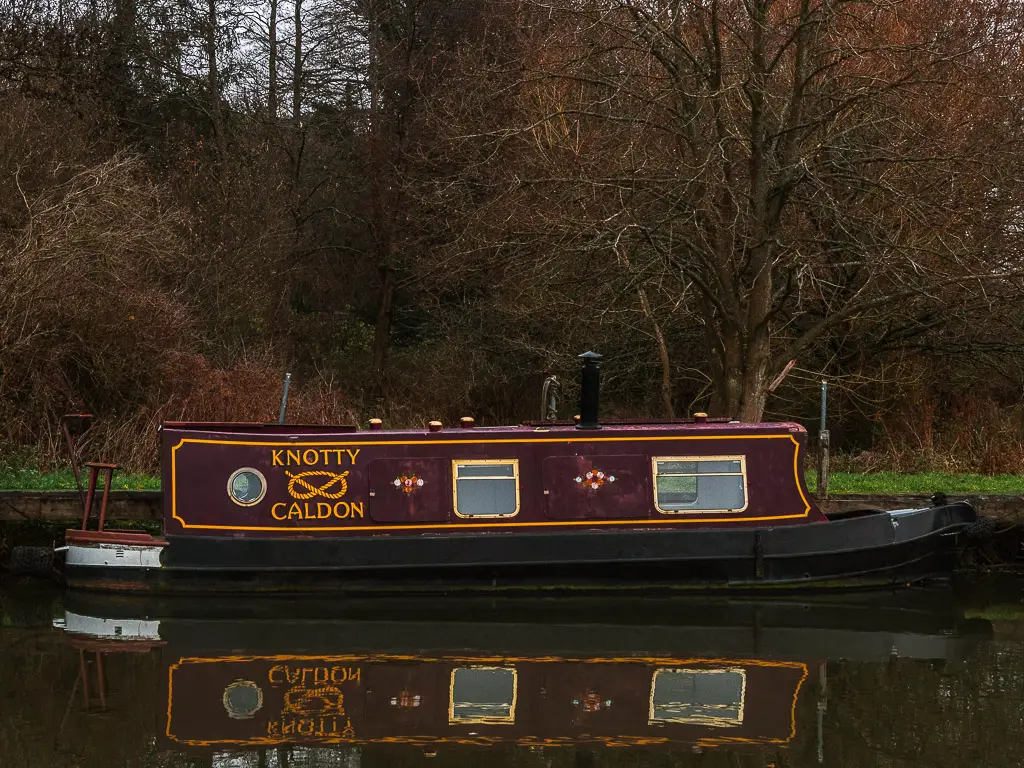 A barge boat moored along the river.