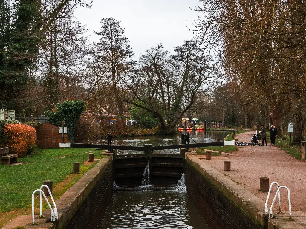 A river lock with water being let through. 