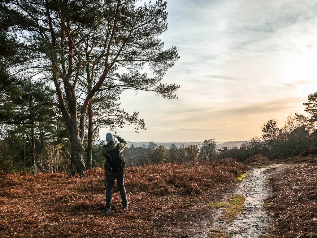 A man taking photos of the view from Gibbit Hill.