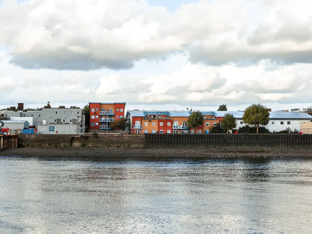 Looking across to the other side of the River Thames to the colourful buildings on the walk between Putney and Battersea.