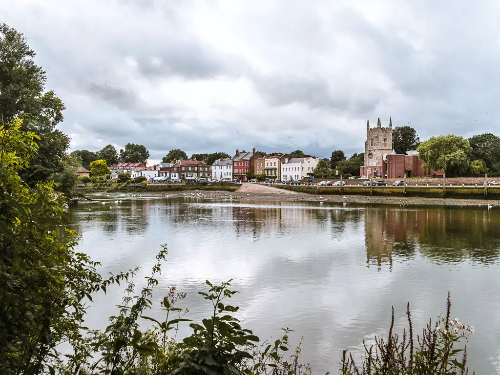 Looking across the River Thames to the Bute houses on the other side on the walk from Richmond to Putney. 