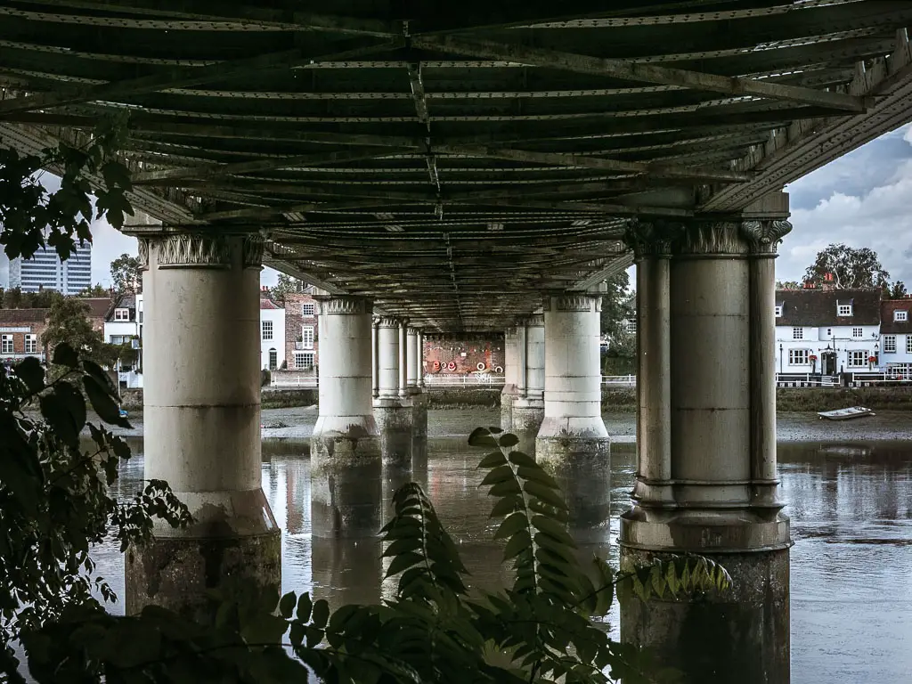 Looking under and along a bridge of the River Thames. 