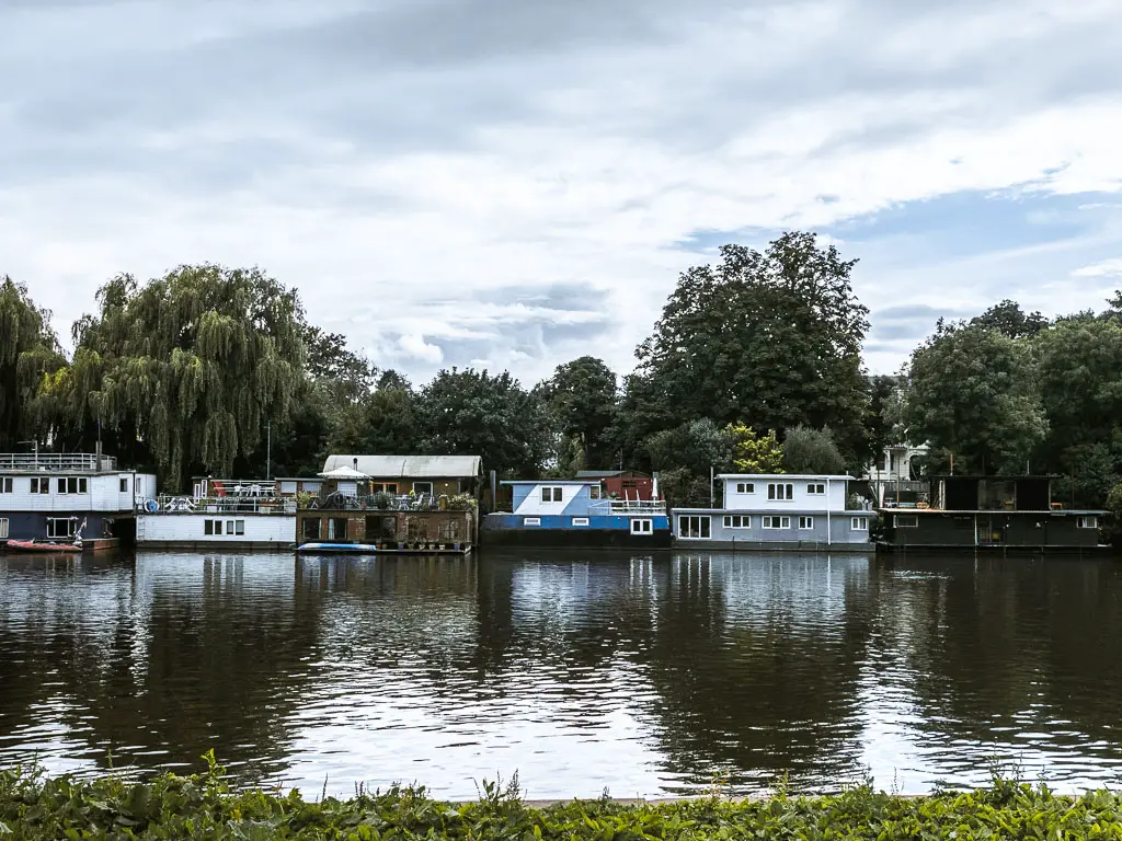 House boats across the river on the Thames Path walk from Richmond to putney.