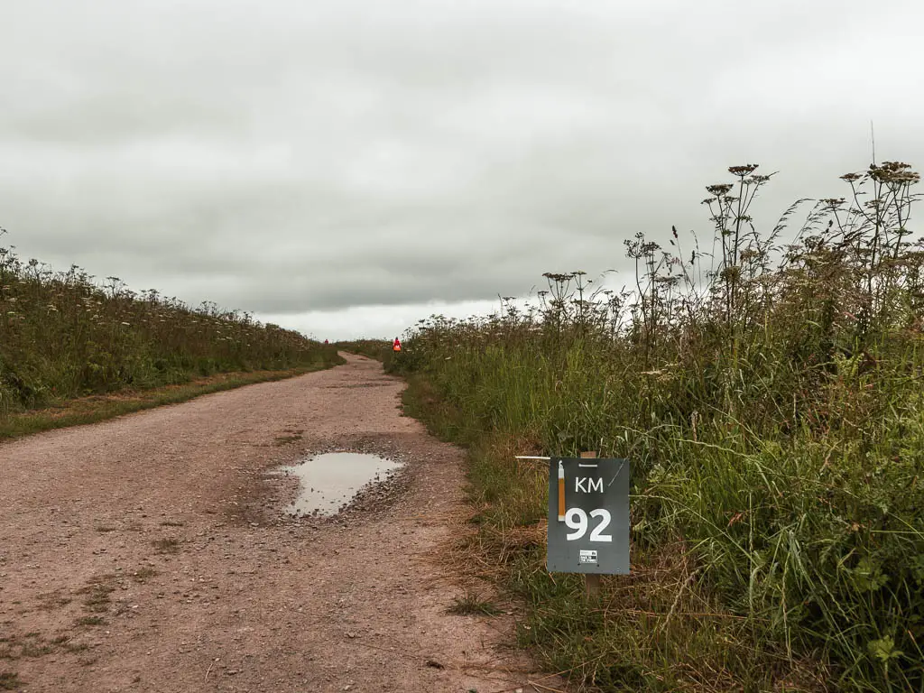 A small sign next to the Ridgeway trail saying '92KM'.