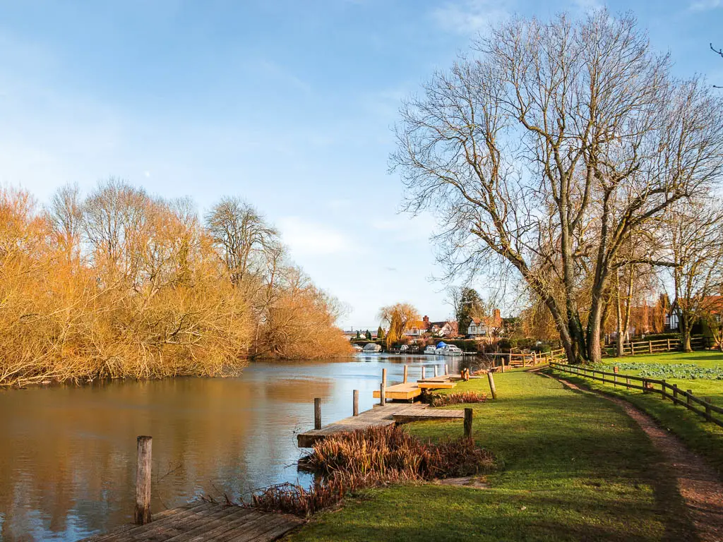 Wooden platforms off the grass bank and onto the River Thames on the walk from Henley to Marlow. 