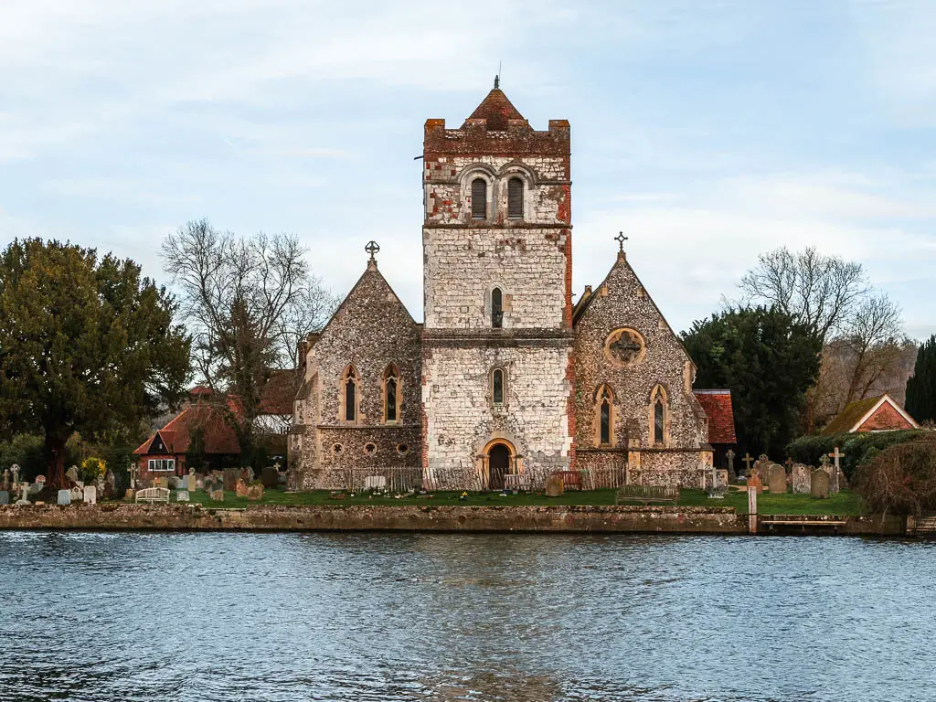 A large church on the other side of the River Thames near the end of the walk from Henley to Marlow. 