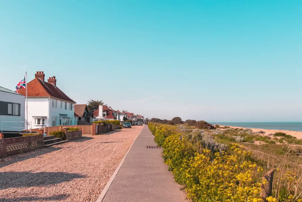 The asphalt path in between houses and ocean near the end of the walk from Dover to Deal.