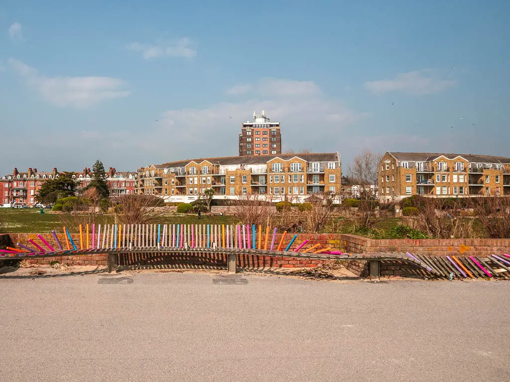 A long colourful bench on the promenade walk in Littlehampton. 