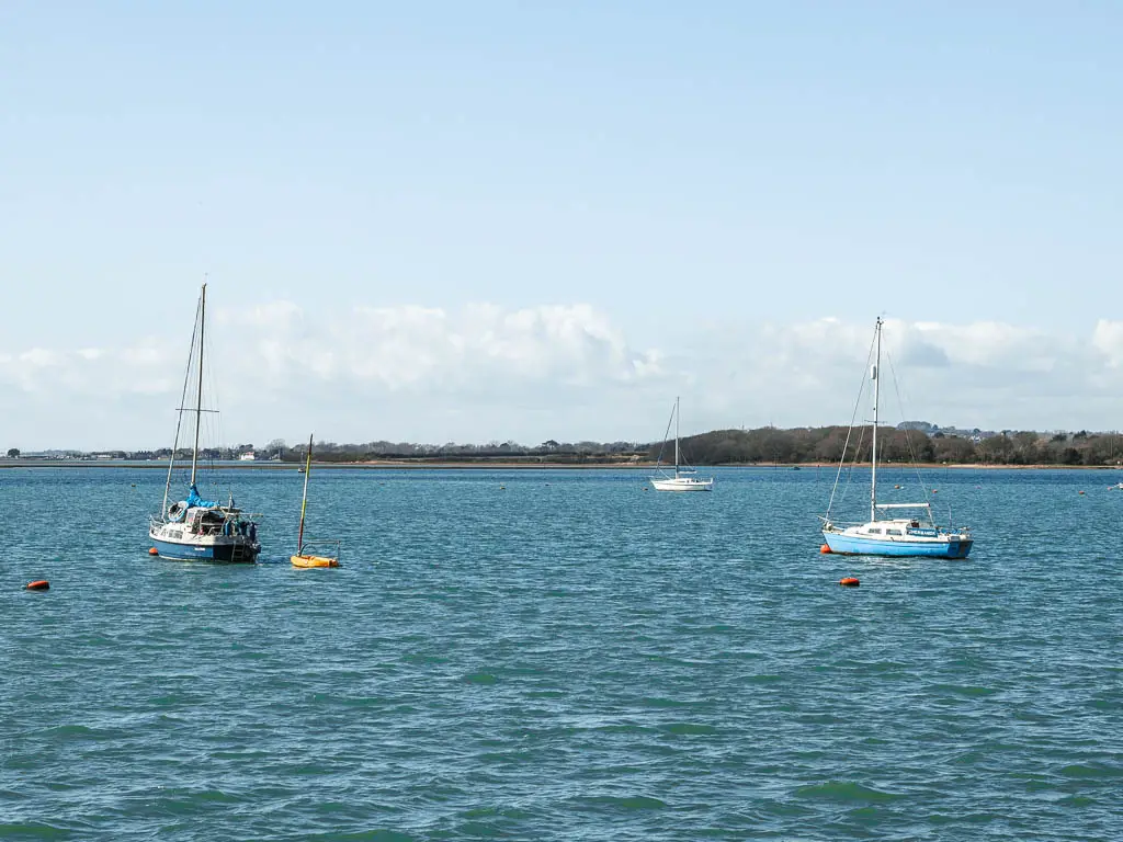 A few boats in the blue sea.