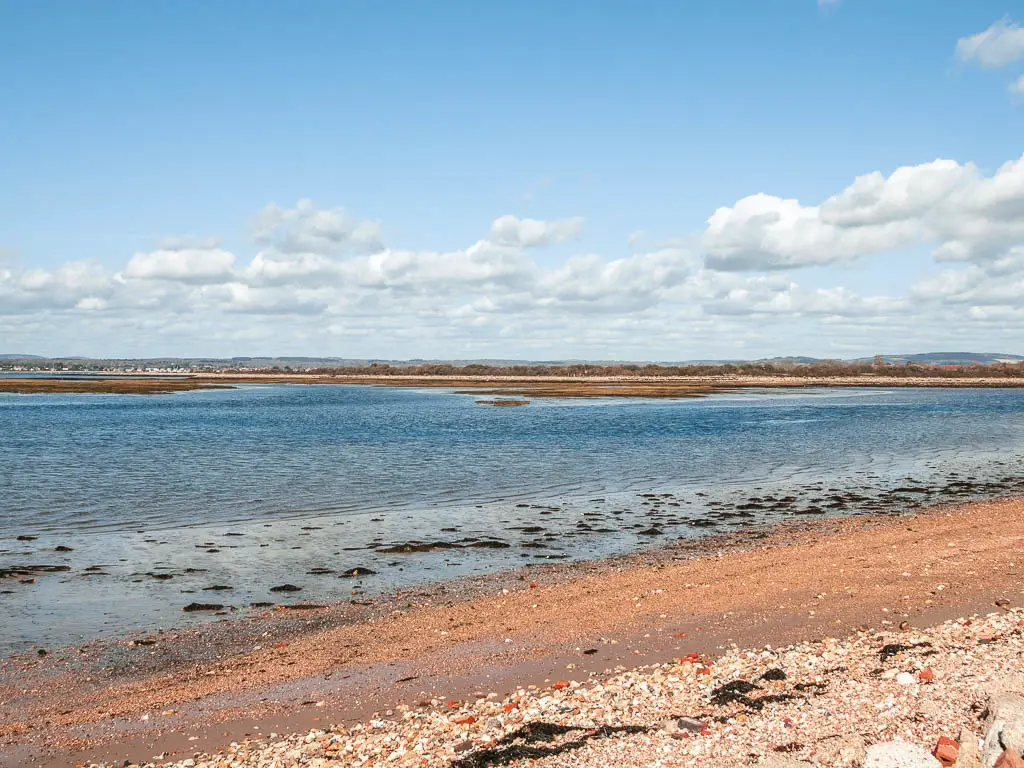 The sand leading to the blue sea on Thorney Island.