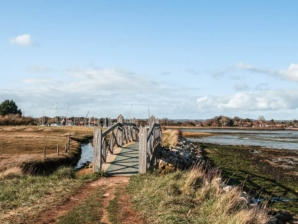 A cute wooden bridge over the waterway.