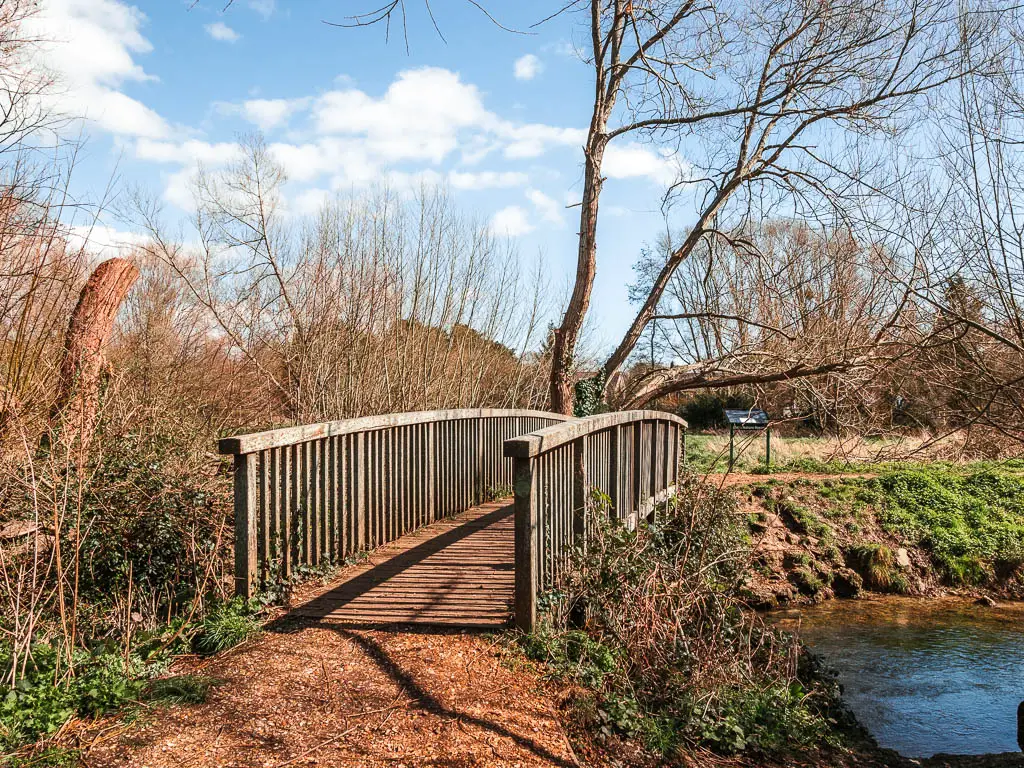 A wooden bridge over the stream.