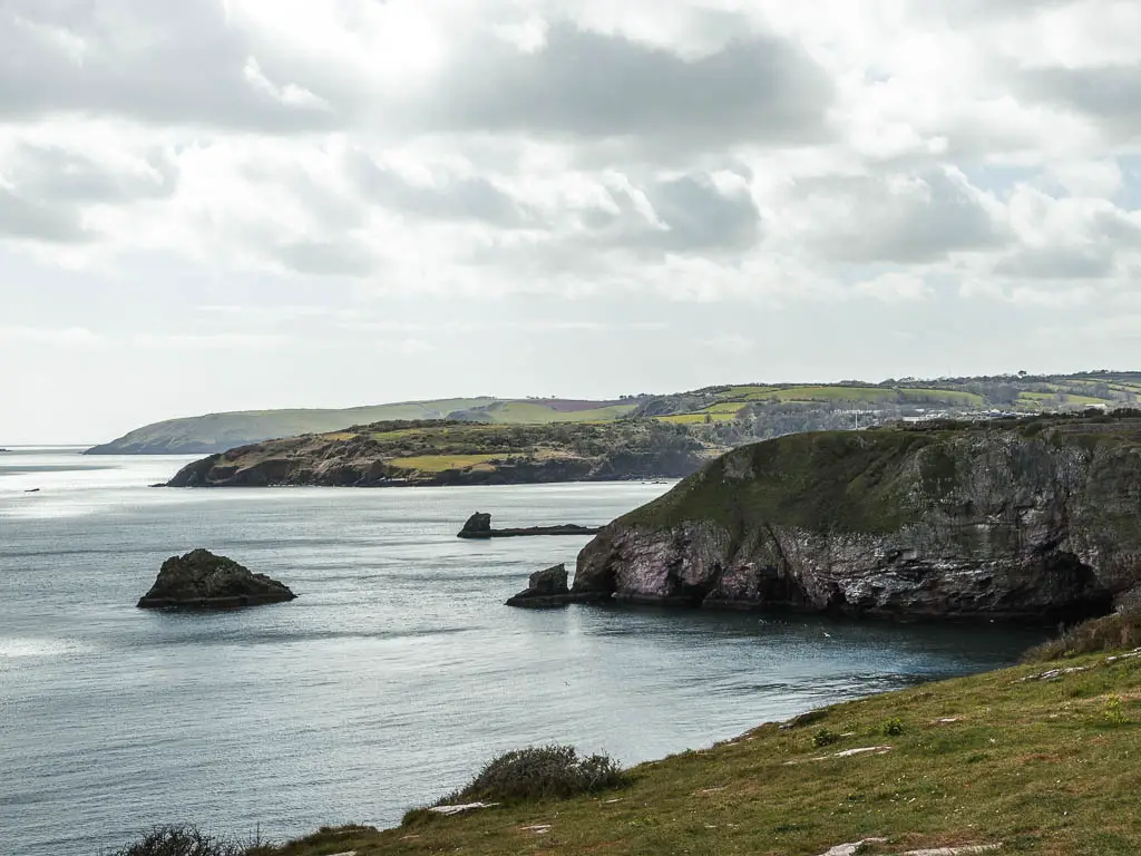 Looking along the cliffy and rocky coastline on the right with the sea on the left on the walk from Brixham to Berry Head.