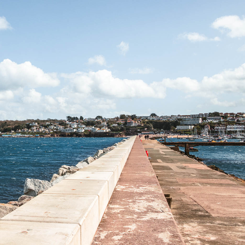 A long straight walkway leading back to Brixham.