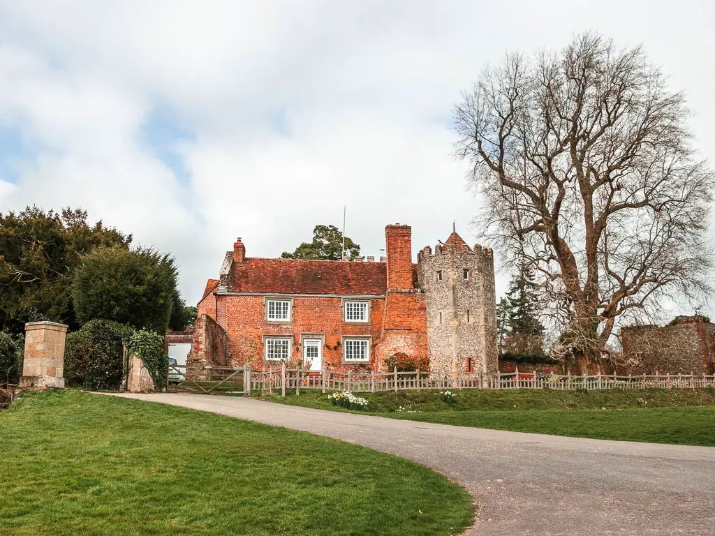 One of the buildings of Greys Court with red Bricks and stone.