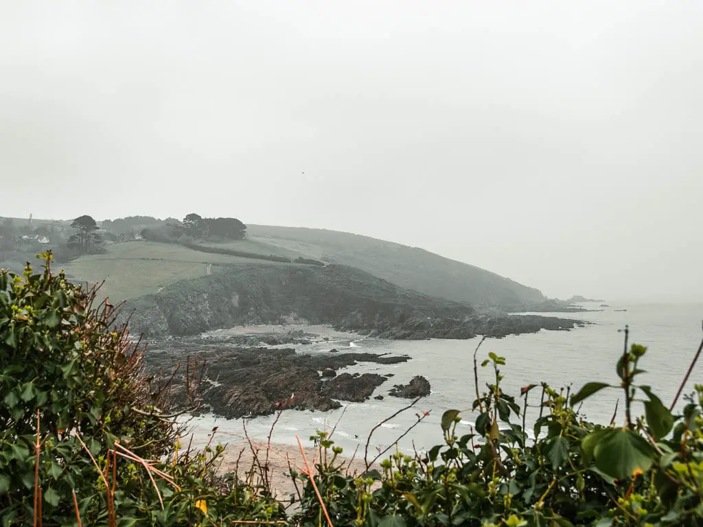 Looking across the the peninsular on the other side of Talland Bay. Its a foggy day.