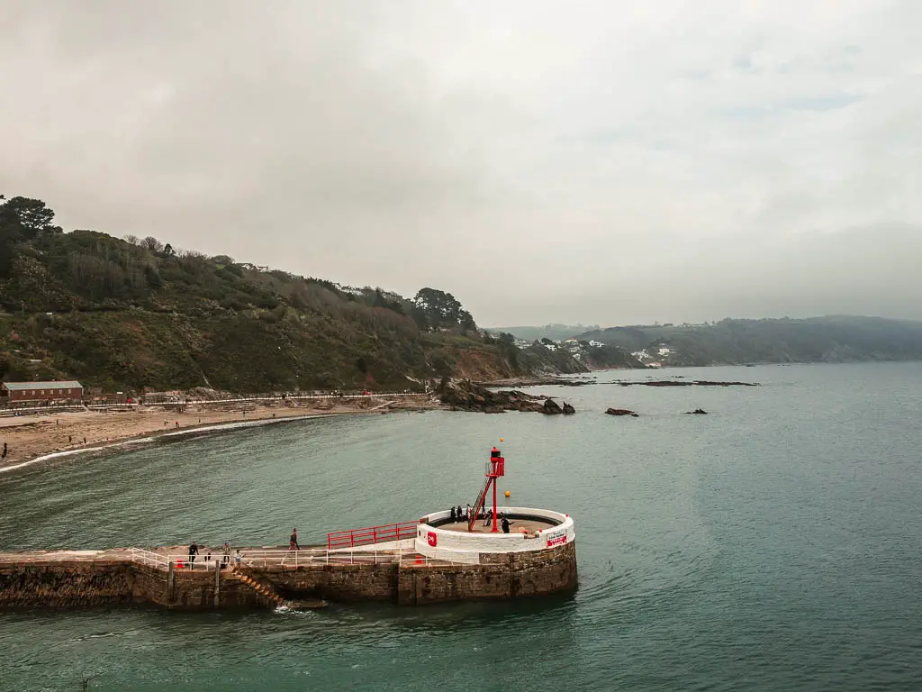 Looking across the sea and Looe estuary to the pier and Looe beach on the other side on the coastal walk to Polperro.