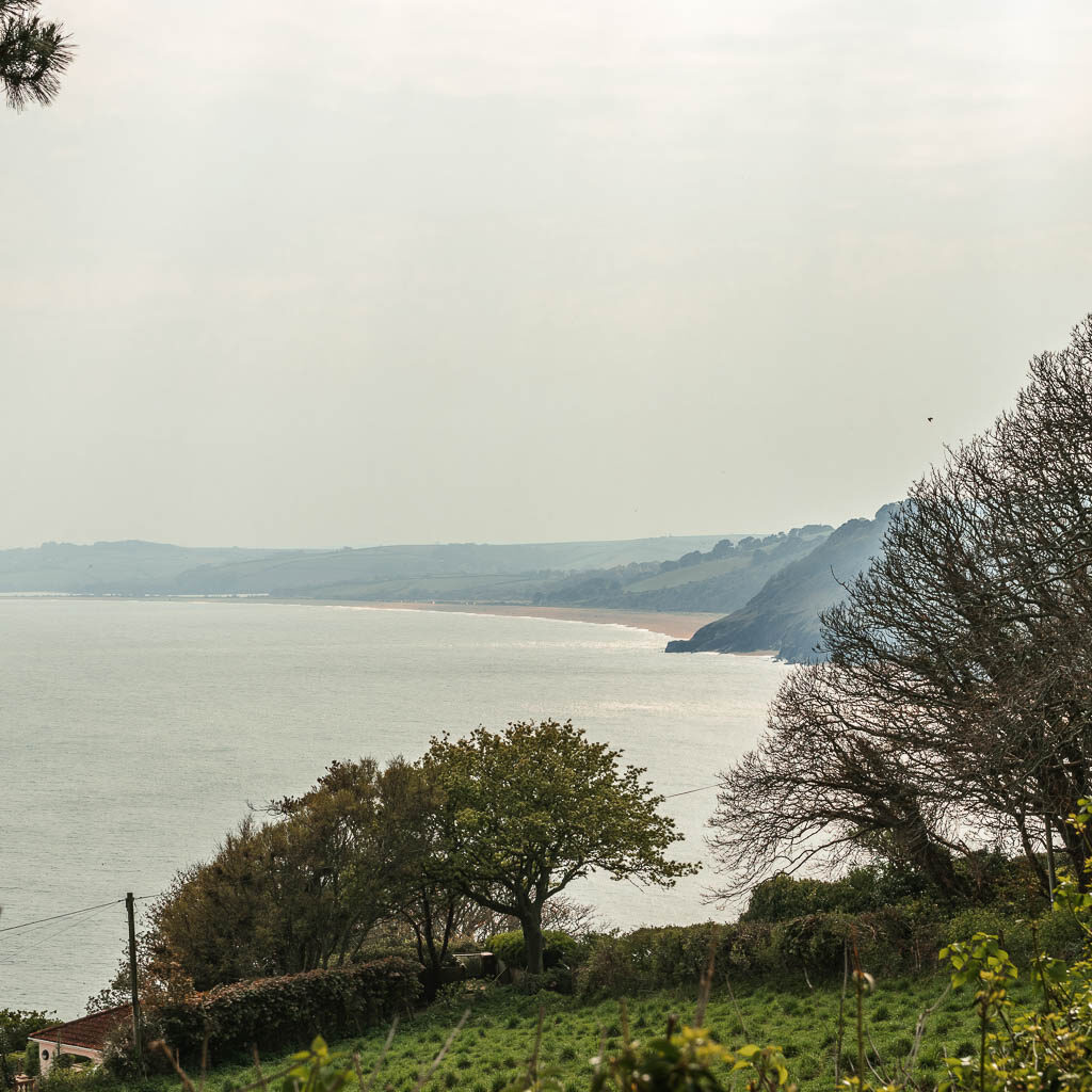 Looking across the green to the sea and the fog covered coastline ahead. 