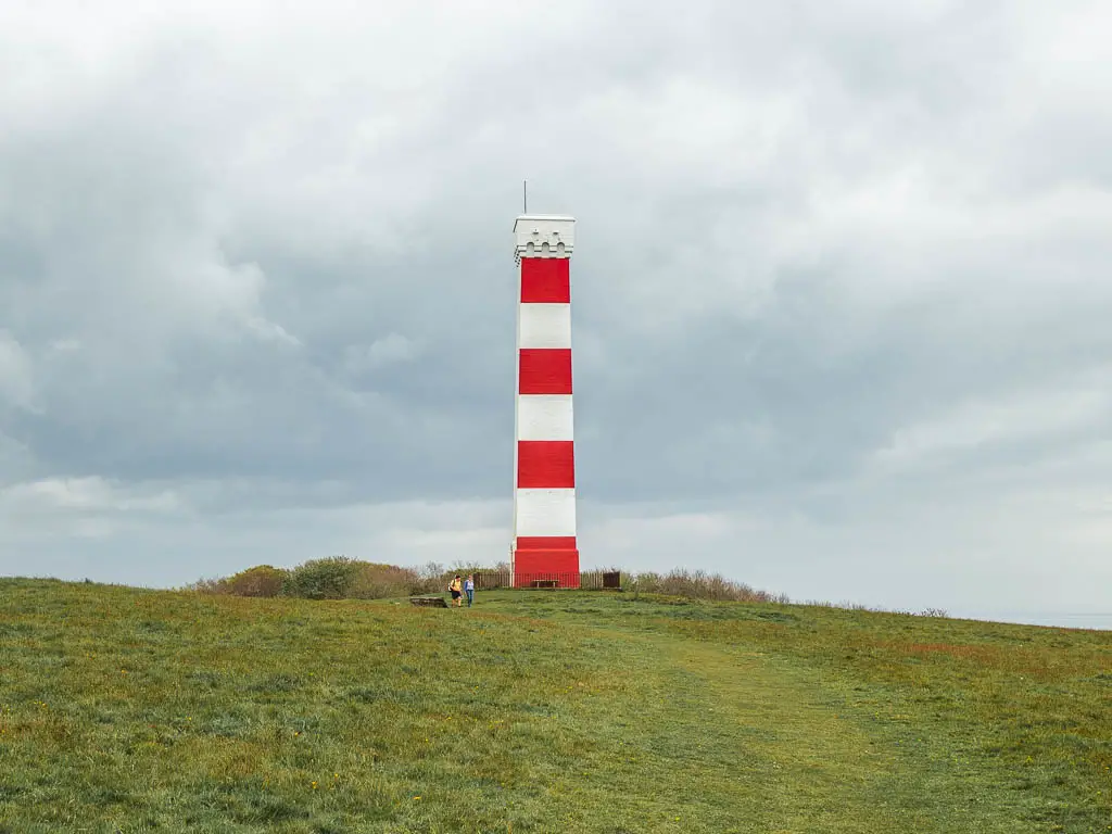 The red and white stripped Gribbin Head Daymark on the coastal walk to Fowey.