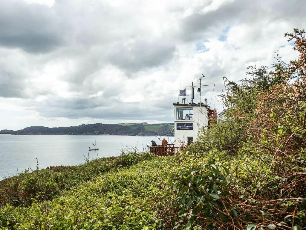 Looking across the bush tops to the white coastguard station on the coastal walk from Charlestown to Par.