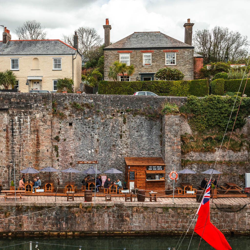 Looking across the harbour to the stone wall in Charlestown at the start of the walk to Par