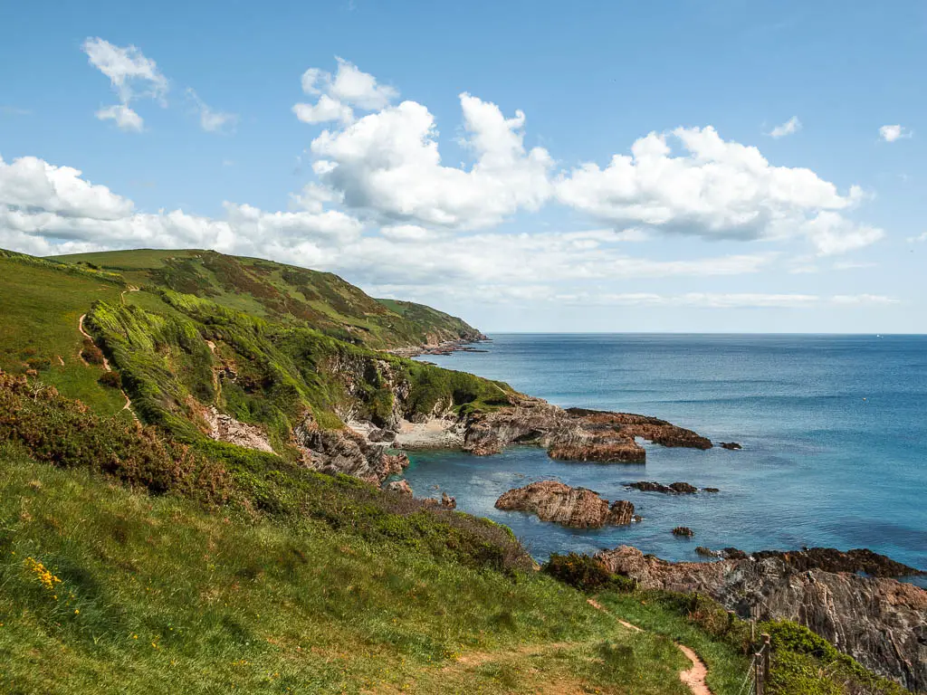 Looking along the undulating hills down the Lantivet Bay coastline on the Fowey to Polperro coastal walk.