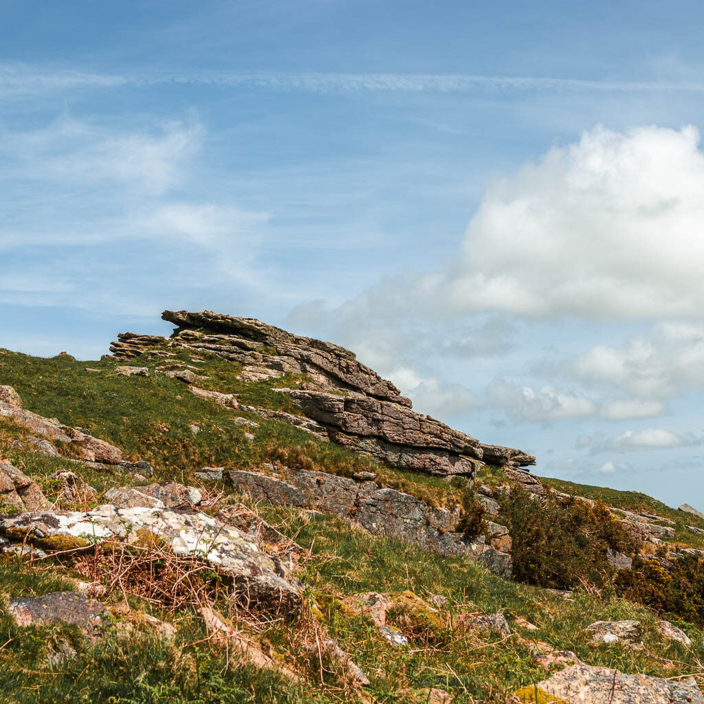 Looking up the the rock tor of Western Beacon on the walk from Ivybridge.