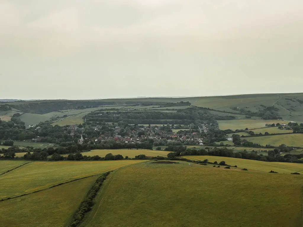 Looking down across the underling hill fields, to a small village on the tore side, in the valley.